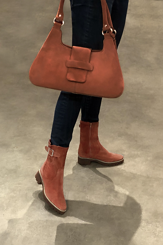 Terracotta orange women's ankle boots with buckles on the sides. Round toe. Low rubber soles. Worn view - Florence KOOIJMAN